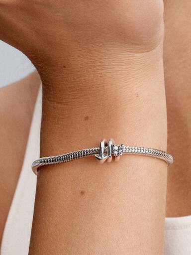 Twisting Arrow Charm
